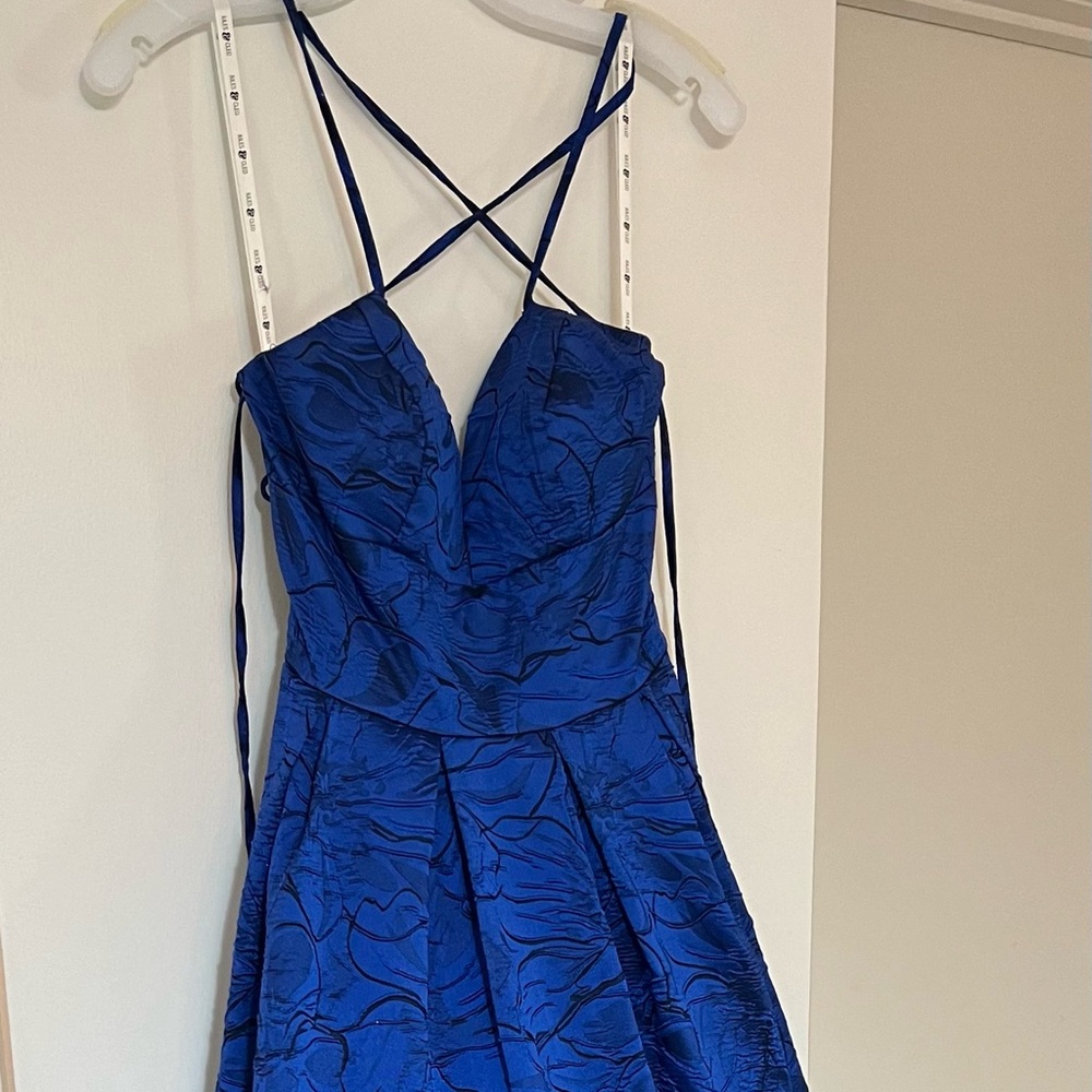 Blue Jaquard cries cross tie back ball gown